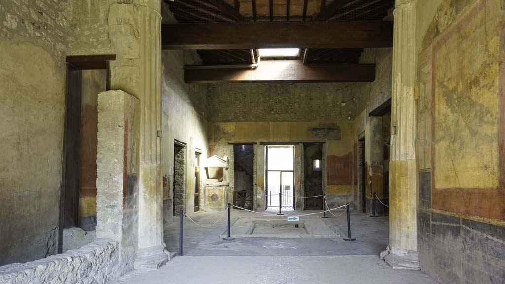 I.10.4 Pompeii. August 2021. 
Room 8, looking north from tablinum across impluvium in atrium, with compluvium above, towards entrance doorway.
Photo courtesy of Robert Hanson.
