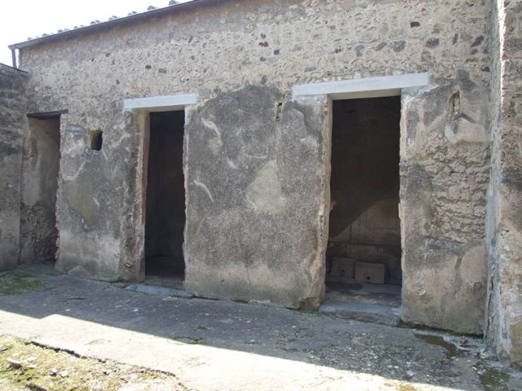 I.10.7 Pompeii. March 2009. Doorways to rooms  6, 5 and 4 on west side of atrium.
