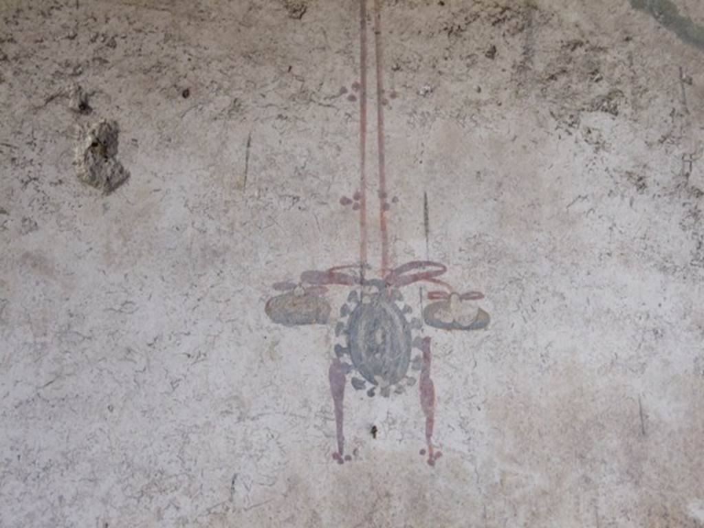I.10.11 Pompeii.  March 2009. Room 10, painting of hanging tambourine from east end of north wall of peristyle.  See Bragantini, de Vos, Badoni, 1981. Pitture e Pavimenti di Pompei, Parte 1. Rome: ICCD.  (p.145).
