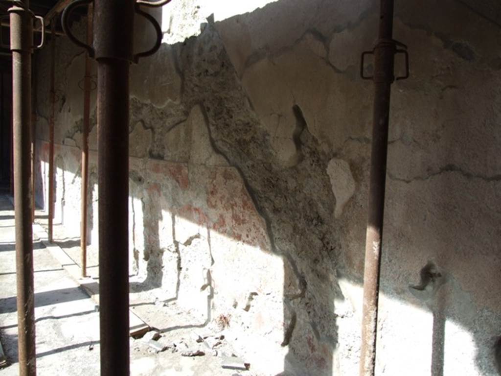 I.10.11 Pompeii. March 2009. 
Room 10, looking west along north wall, showing  outline of staircase to upper floor in plaster on north wall of peristyle.
