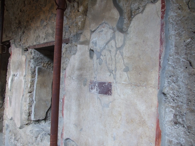 I.10.11 Pompeii. March 2009. Room 10, east wall of peristyle, between doorways to room 11 and room 12.  According to PPP, there was graffiti on this wall, perhaps on the “violet” panel, perhaps near a painted garland?  The one near the painted garland was on a white background and identified as CIL IV 8404b See Bragantini, de Vos, Badoni, 1981. Pitture e Pavimenti di Pompei, Parte 1. Rome: ICCD. (p.144)
According to Epigraphik-Datenbank Clauss/Slaby (See www.manfredclauss.de), it read as -
Ur{u}sa     [CIL IV 8404b]


