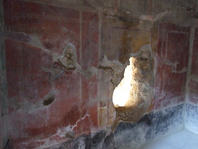 I.10.11 Pompeii.  March 2009.  Room 12.  Cubiculum.  North wall.  Ancient hole in wall.