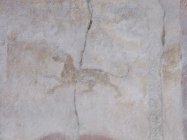 I.10.11 Pompeii.  March 2009.  Room 12.  Cubiculum.  East wall.  Upper part.  Painting of panther.