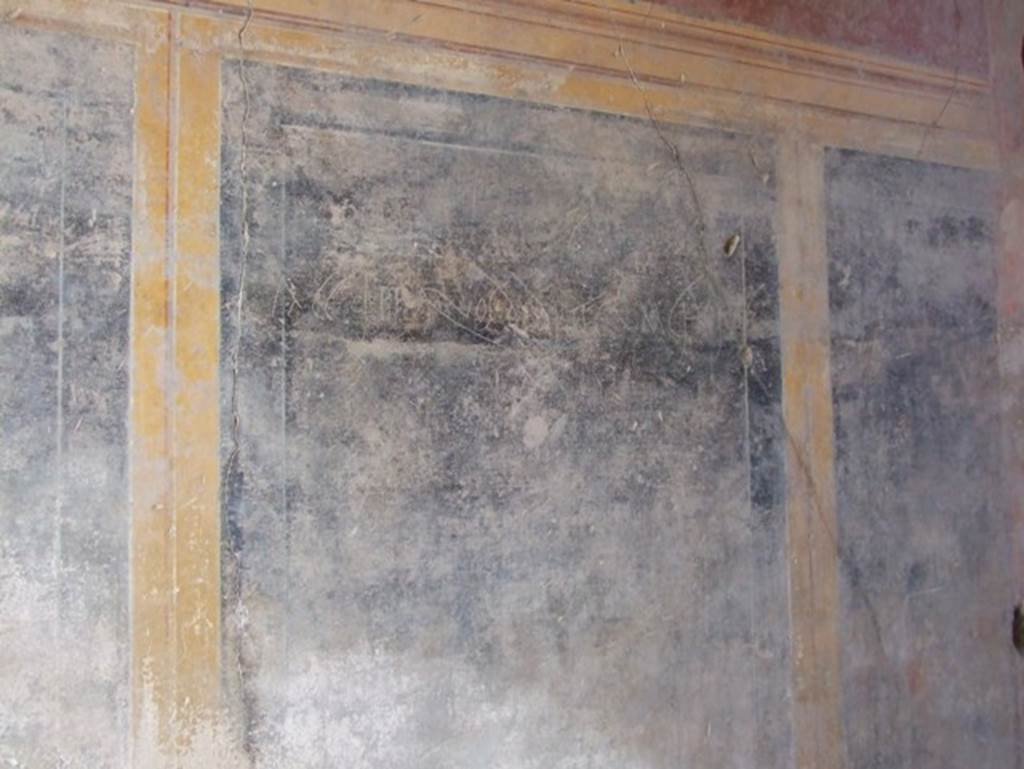 I.10.11 Pompeii. March 2009. Room 1, north wall of fauces with graffito scratched on wall.