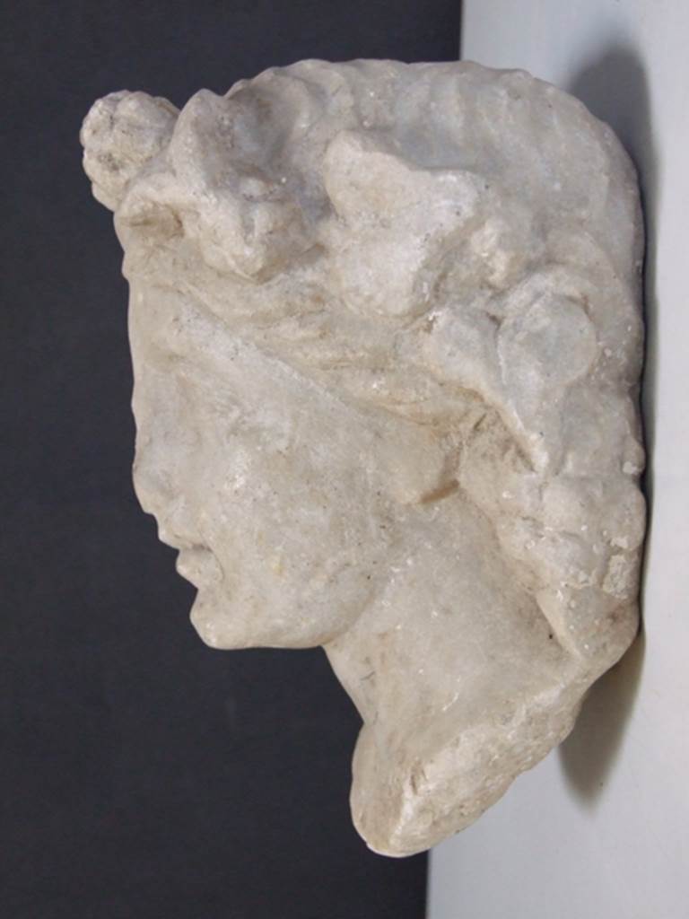 I.11.12 Pompeii. March 2009.  White marble Herm of Bacchante.  Found in a cavity in the South wall near the Aedicula Niche in 1958.  SAP inventory number: 12165.
