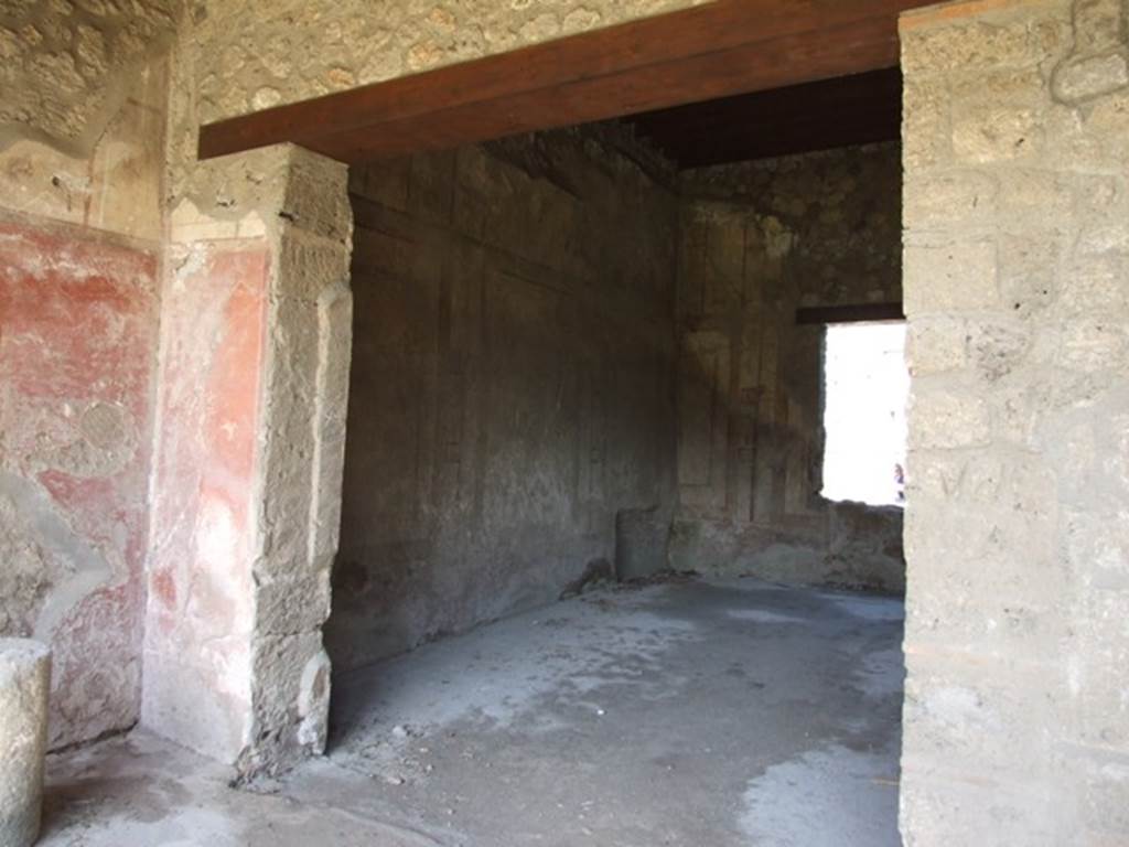I.12.2 and I.12.1 Pompeii.  March 2009.  Room 7. Triclinium. Looking north west from portico area.