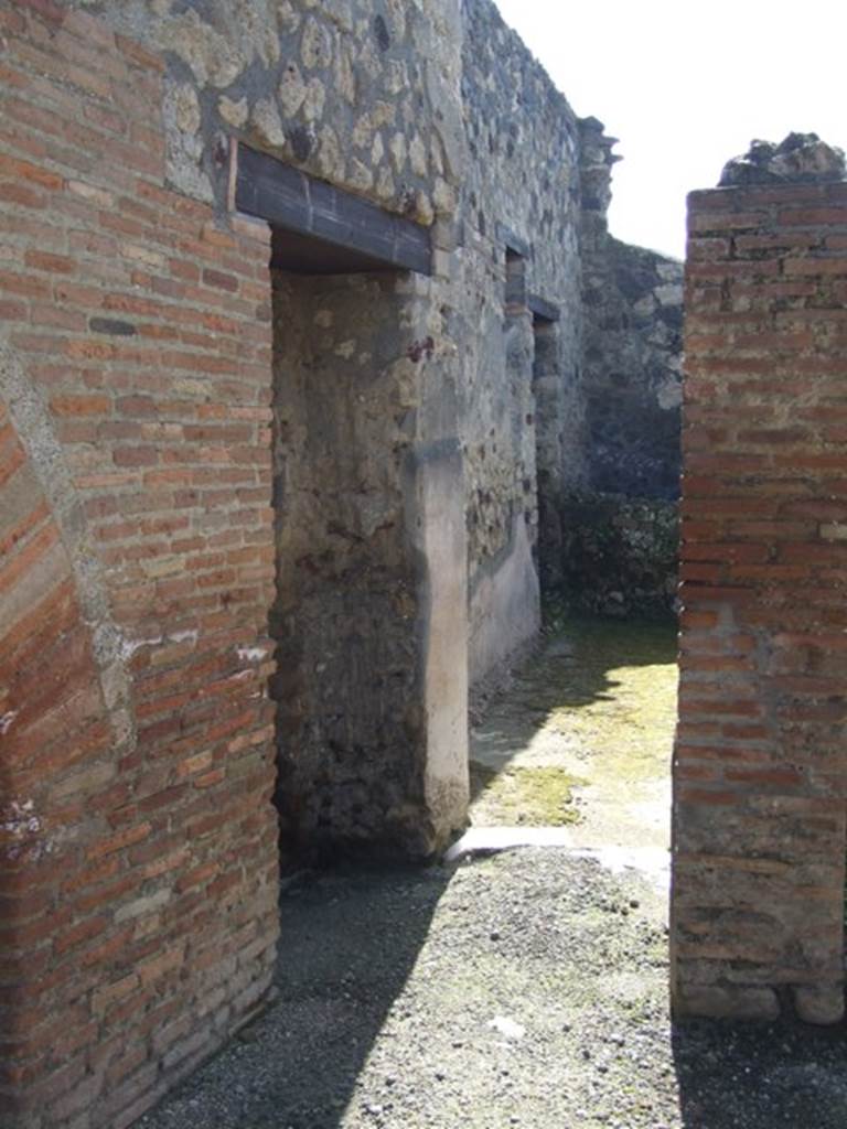 I.12.2 and I.12.1 Pompeii.  March 2009.  Doorway to room 13 (on left) and room 14 (ahead)