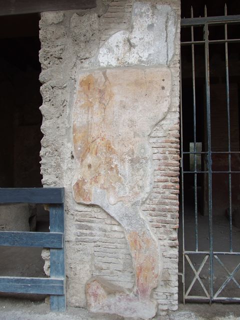 I.12.3 Pompeii. December 2018. Graffiti and plaster on wall to west of door. Photo courtesy of Aude Durand.