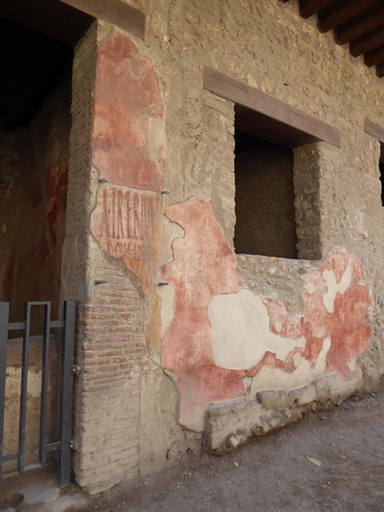 I.12.3 Pompeii, May 2018. Detail of graffiti on the west side of the doorway. Photo courtesy of Buzz Ferebee.

