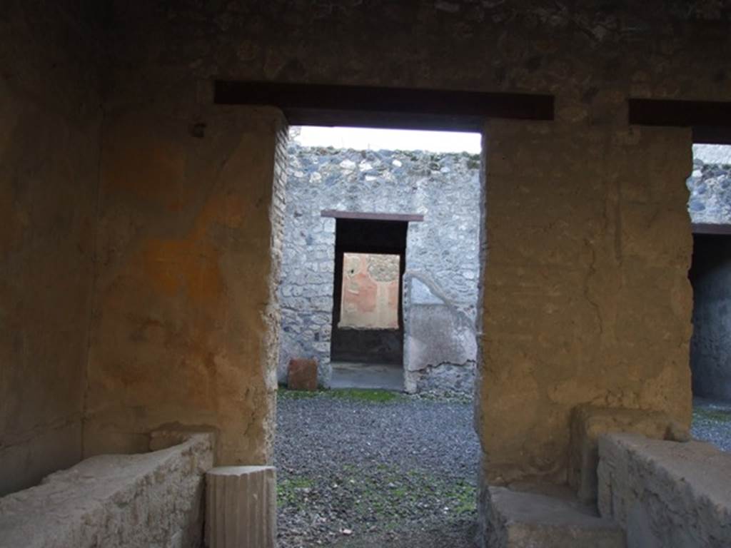 I.12.5 Pompeii. December 2007. Looking south through rear of caupona across atrium to the triclinium with window.
