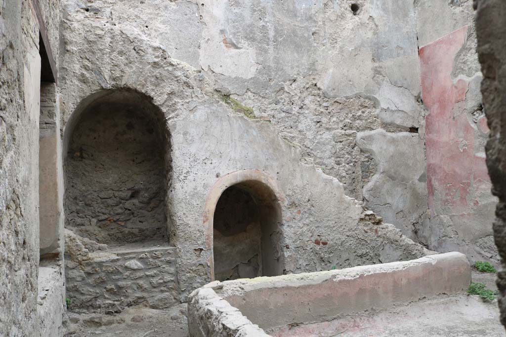 I.12.5 Pompeii. December 2018. 
Looking east across garden area towards two masonry alcoves built under the stairs against the east wall.
Photo courtesy of Aude Durand.
