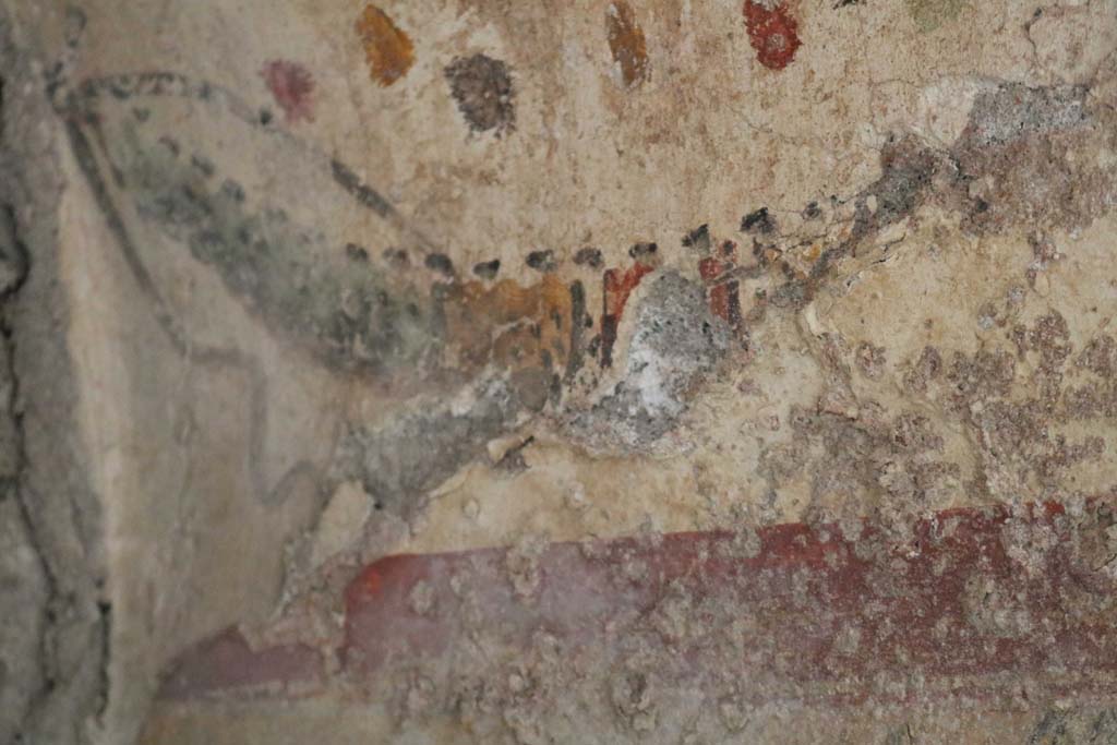 I.12.5 Pompeii. December 2018. Detail of upper painted decoration on south side of painted lararium. Photo courtesy of Aude Durand.