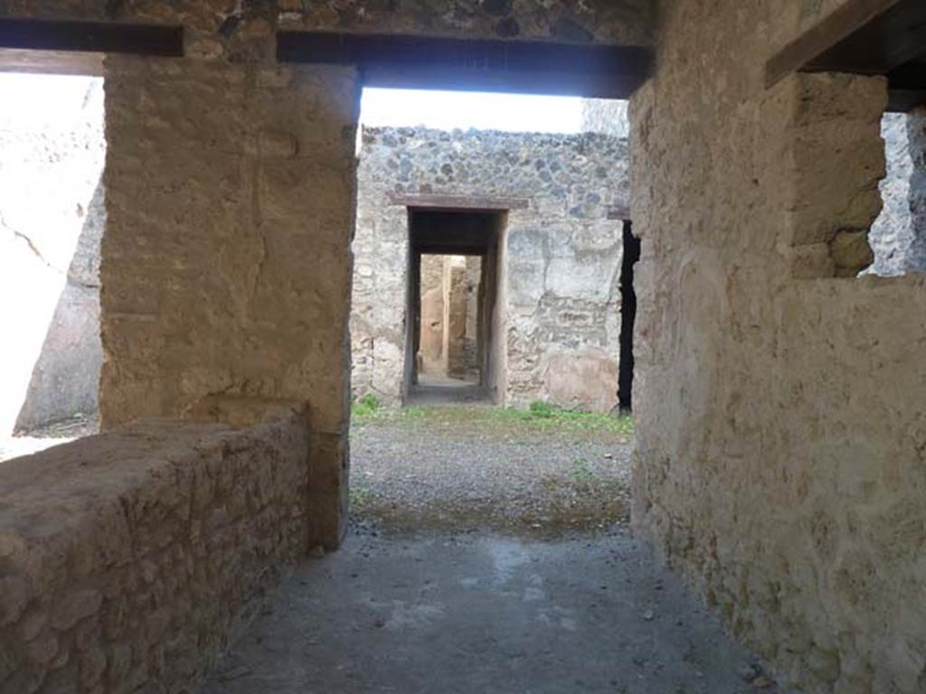 I.12.5 Pompeii. September 2015. Looking south through corridor to rear rooms and garden.