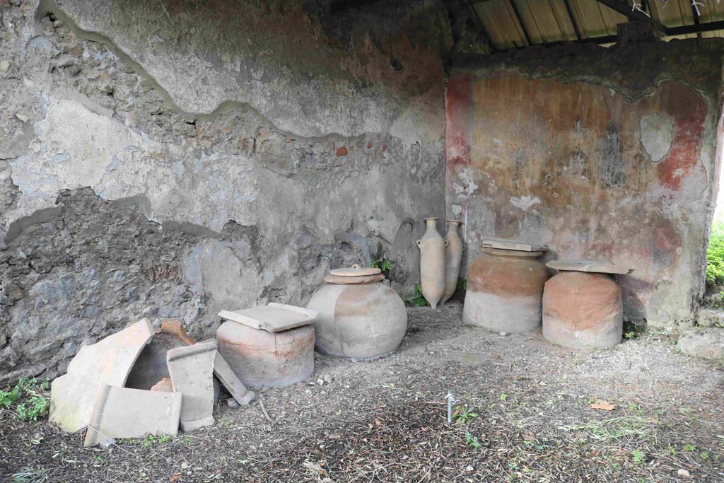 I.12.8 Pompeii. December 2018. Room 9, looking towards north-west corner and dolia. Photo courtesy of Aude Durand.