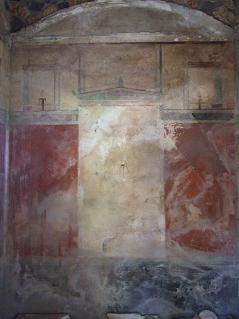 I.12.8 Pompeii. March 2009. Room 11, north wall of cubiculum. According to Curtis, on Eschebach’s 1969 plan of the house a doorway is shown from this cubiculum into the house at I.12.14.  This is an error. See Curtis R.L: The Garum shop of Pompeii, In Cronache Pompeiane, V.1979, p.8, note 5.  He also described this room as having a beautiful third style wall painting on three of its walls. The bordering appeared in deep green and the architectural structure above the panels contained differently shaped amphorae.
A large panel on each of the three walls contained a simple idyllic scene on a white background. See Curtis R.L: The Garum shop of Pompeii, In Cronache Pompeiane, V.1979, (p.20).

