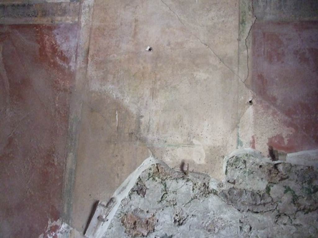 I.12.8 Pompeii.  March 2009.  Room 11. East wall above door.