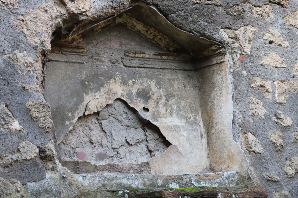 I.12.12 Pompeii. December 2018. Detail of niche of lararium in west wall. Photo courtesy of Aude Durand.