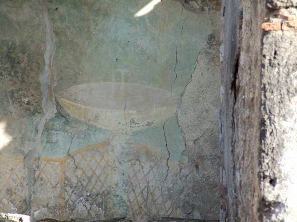 I.12.16 Pompeii.  December 2007.  Garden painting visible from the entrance.   Wall painting of a garden fountain in a bowl or labrum with trellis underneath.