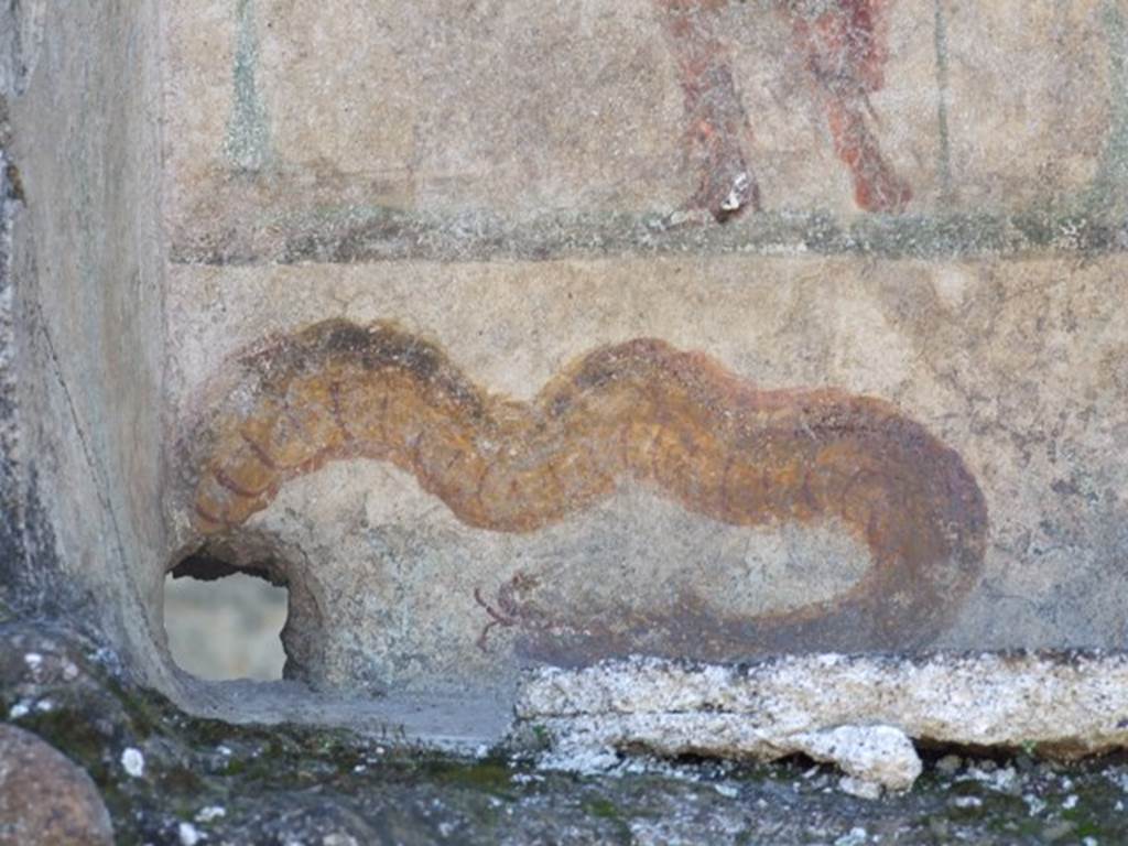 I.12.16 Pompeii. March 2009. Room 1, atrium. Painted brown serpent in niche on south wall.