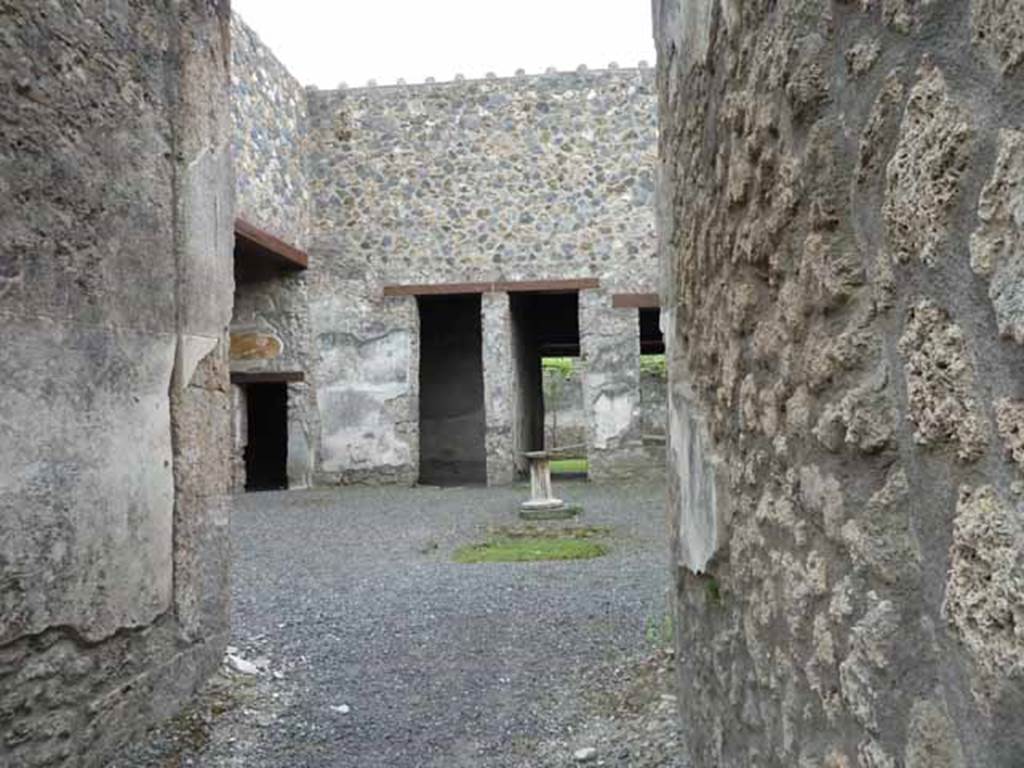 I.13.2 Pompeii. May 2010. Looking towards south-east side of atrium, with small doorway in south wall of left ala. 