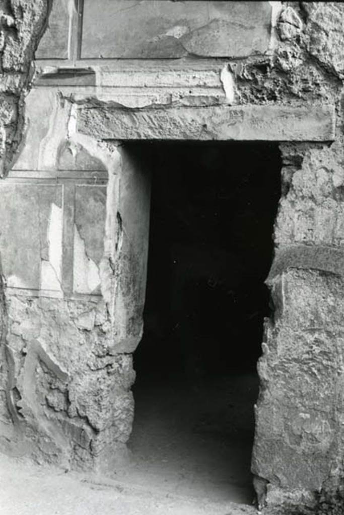 I.13.2 Pompeii. 1975. Domus of Sutoria Primigenia, left ala, right S wall, doorway.  
Photo courtesy of Anne Laidlaw.
American Academy in Rome, Photographic Archive. Laidlaw collection _P_75_6_12.
