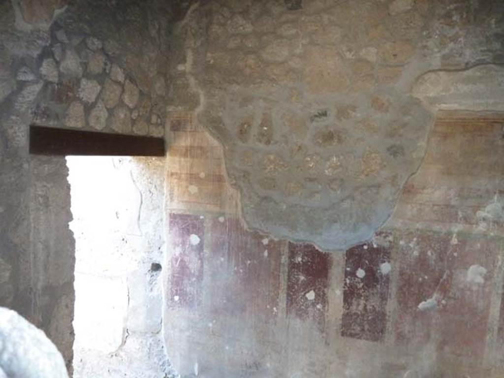 I.13.2 Pompeii, September 2015. West wall of anteroom, with small doorway to oecus, on the left in the south-west corner. Taken through window from I.13.3.
