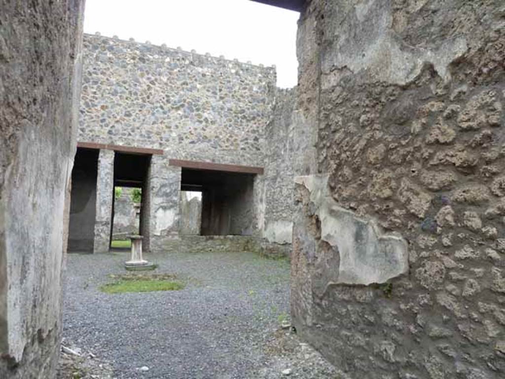 I.13.2 Pompeii. May 2010. West side of atrium, looking towards doorway to garden, and triclinium.
