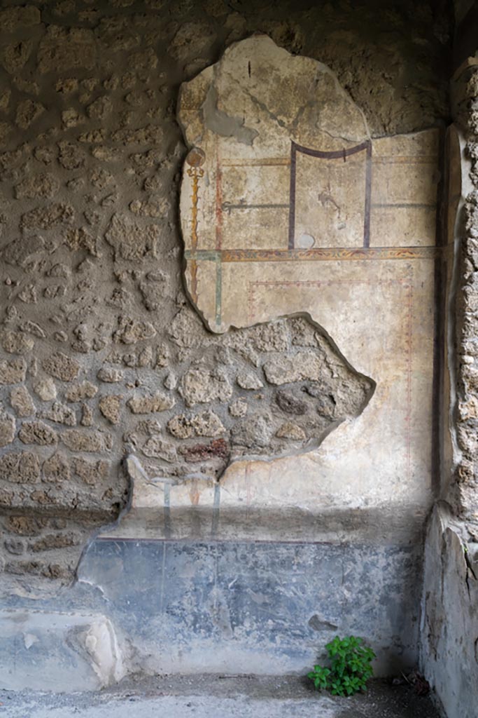 I.13.2 Pompeii. March 2023. 
Detail from north end of west wall in triclinium. Photo courtesy of Johannes Eber.
