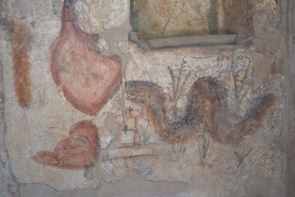 I.13.2 Pompeii. October 2019. Serpent painted below niche on north wall of kitchen.
Foto Annette Haug, ERC Grant 681269 DÉCOR.
