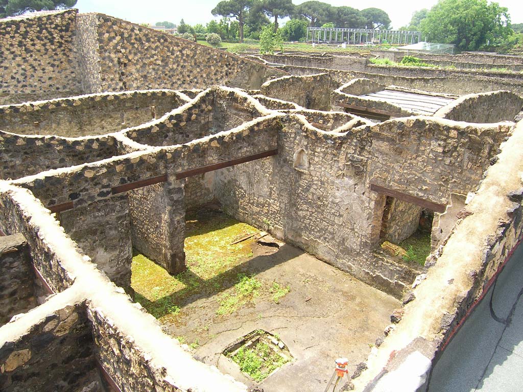 I.14.2 Pompeii. July 2008. Looking south-west across atrium towards doorways to rooms E and F.
Photo courtesy of Guilhem Chapelin. 
