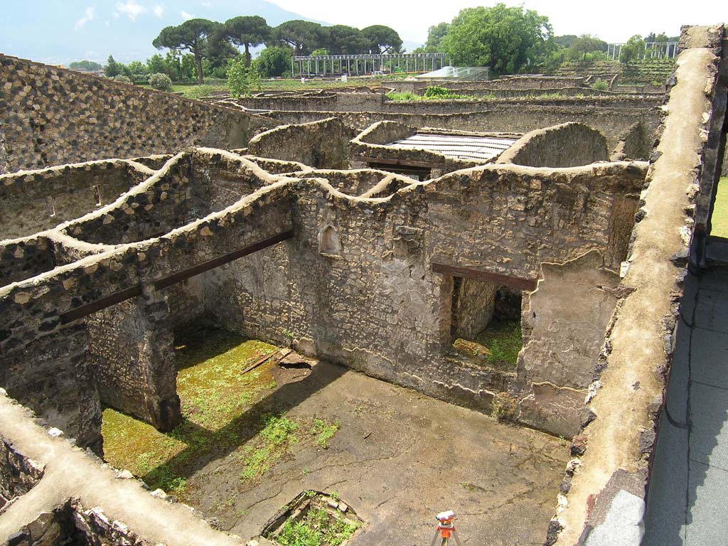 I.14.2 Pompeii. July 2008. 
Looking south-west across atrium towards doorways to rooms E and F and window to Garden M.
Photo courtesy of Guilhem Chapelin. 
