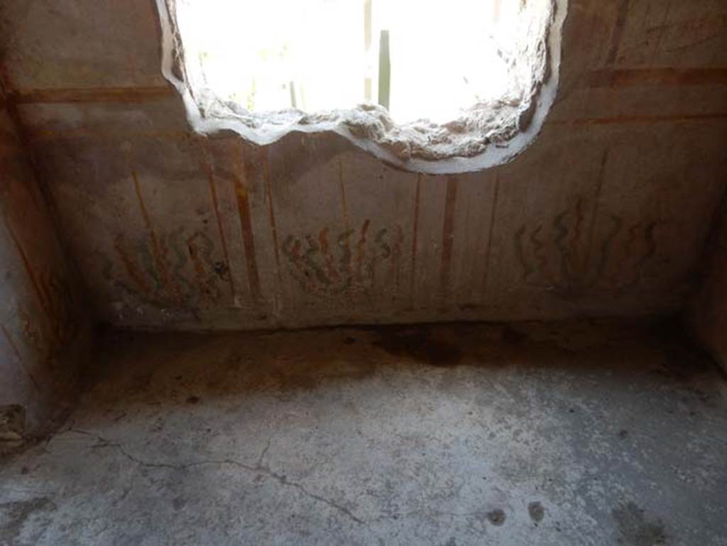 I.14.12, Pompeii. May 2018. Room 2, west wall below window. Photo courtesy of Buzz Ferebee