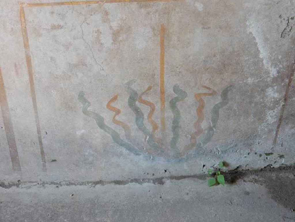 I.14.12, Pompeii. May 2018. Room 2, painted stylised plants on zoccolo of north wall. 
Photo courtesy of Buzz Ferebee

