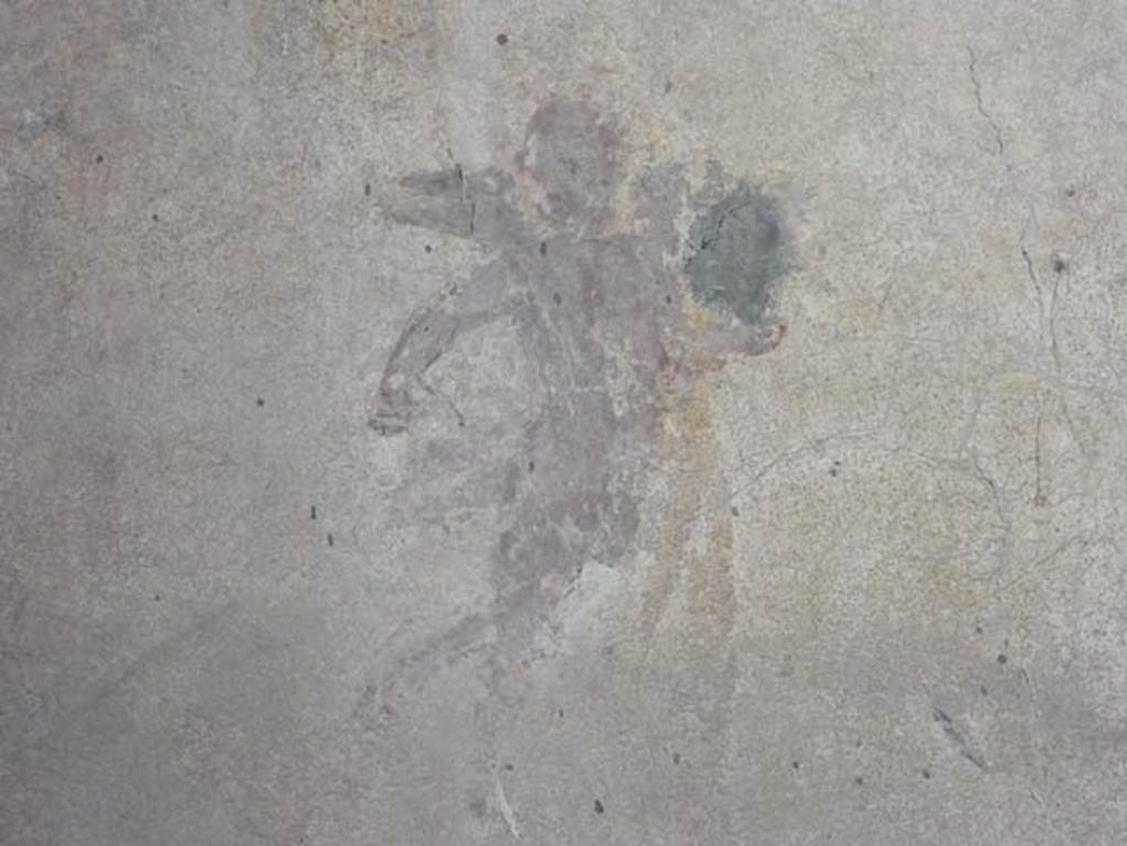 I.14.12, Pompeii. May 2018. Room 2, painted flying cupid detail from north wall at west end. 
Photo courtesy of Buzz Ferebee
