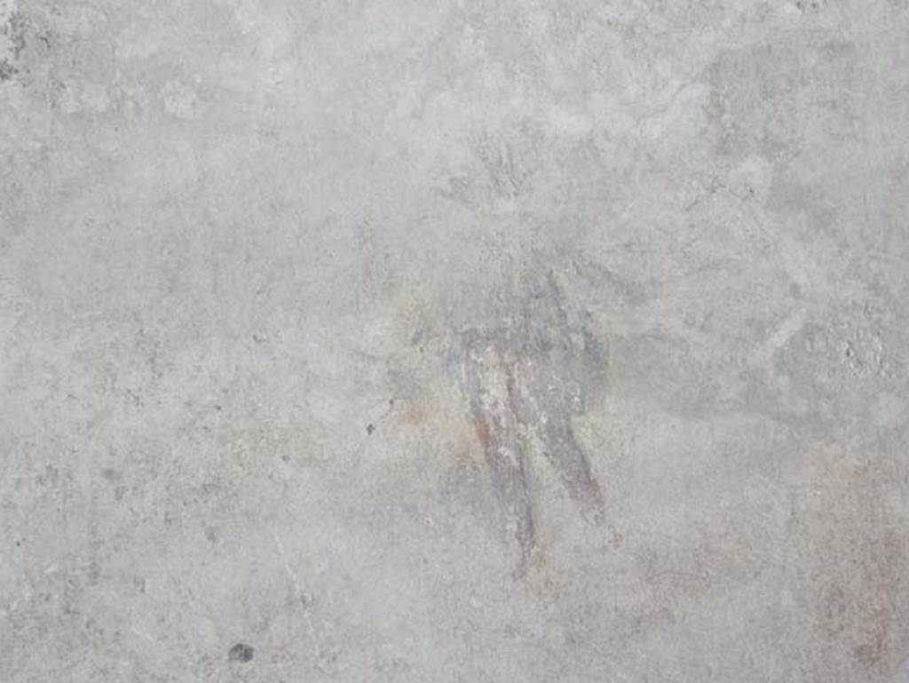 I.14.12, Pompeii. May 2018. Room 2, detail of remains of painted flying cupid, from east end of north wall.
Photo courtesy of Buzz Ferebee
