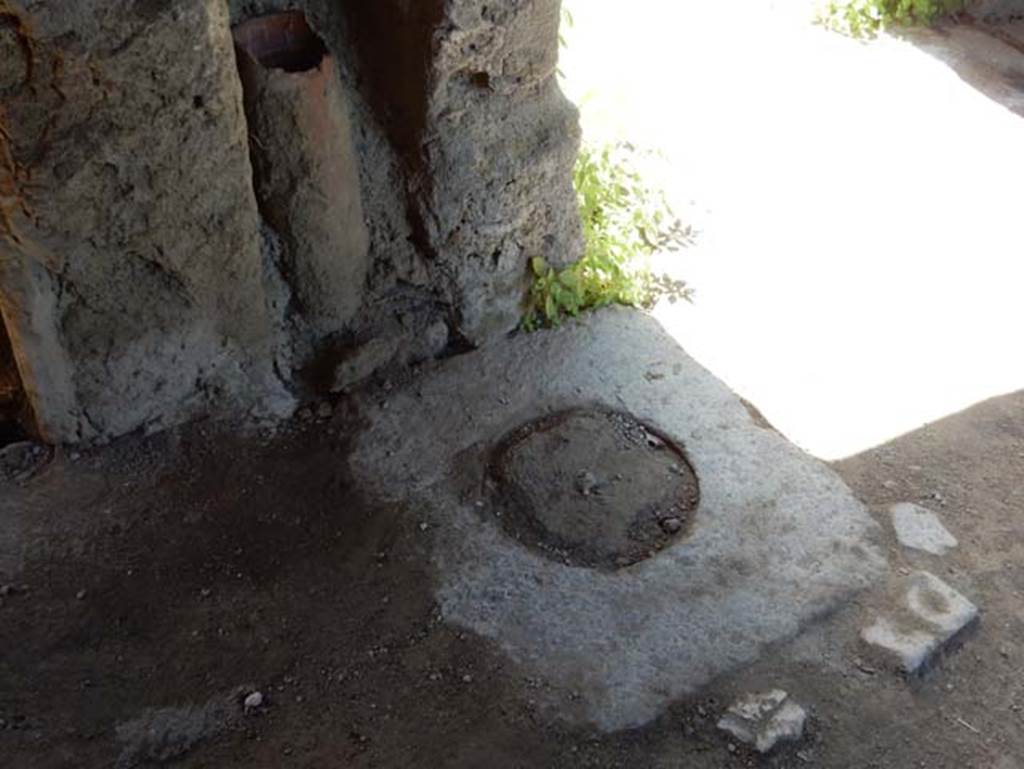 I.14.12, Pompeii. May 2018. Cistern mouth in south-west corner of east portico 32, looking south towards corridor 9 to entrance at I.14.12. Photo courtesy of Buzz Ferebee.
