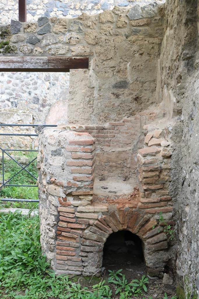 I.20.3 Pompeii. December 2018. 
Looking east towards oven in south-east corner of rear-room. Photo courtesy of Aude Durand.
