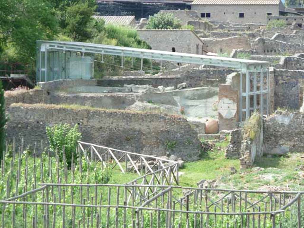 I.22.1 and I.22.2 Pompeii. May 2010. Looking north to area covered by blue girders, I.22.1 