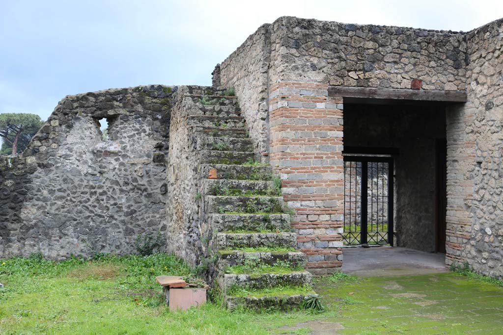 II.8.1 Pompeii. December 2018. 
Looking west in garden area, towards stairs built against the south wall with the oven. Photo courtesy of Aude Durand.
