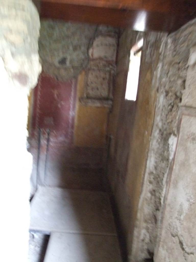 II.9.4 Pompeii. December 2007. Doorway to room 6, cubiculum with floral lararium. 