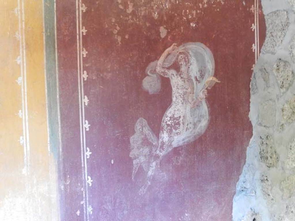II.9.4, Pompeii. May 2018. Room 6, painted figure on red panel on west wall. Photo courtesy of Buzz Ferebee. 