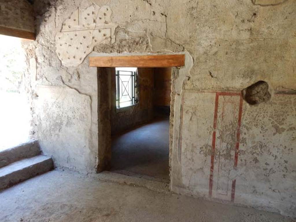 II.9.4, Pompeii. May 2018. Room 5, doorway in south wall to room 8, an oecus.
Photo courtesy of Buzz Ferebee. 
