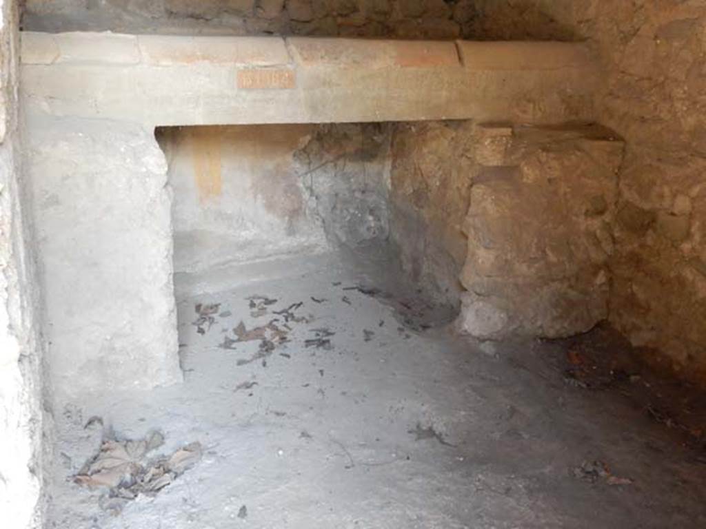 II.9.4, Pompeii. May 2018. Room 7, kitchen bench/hearth against north wall. Photo courtesy of Buzz Ferebee. 