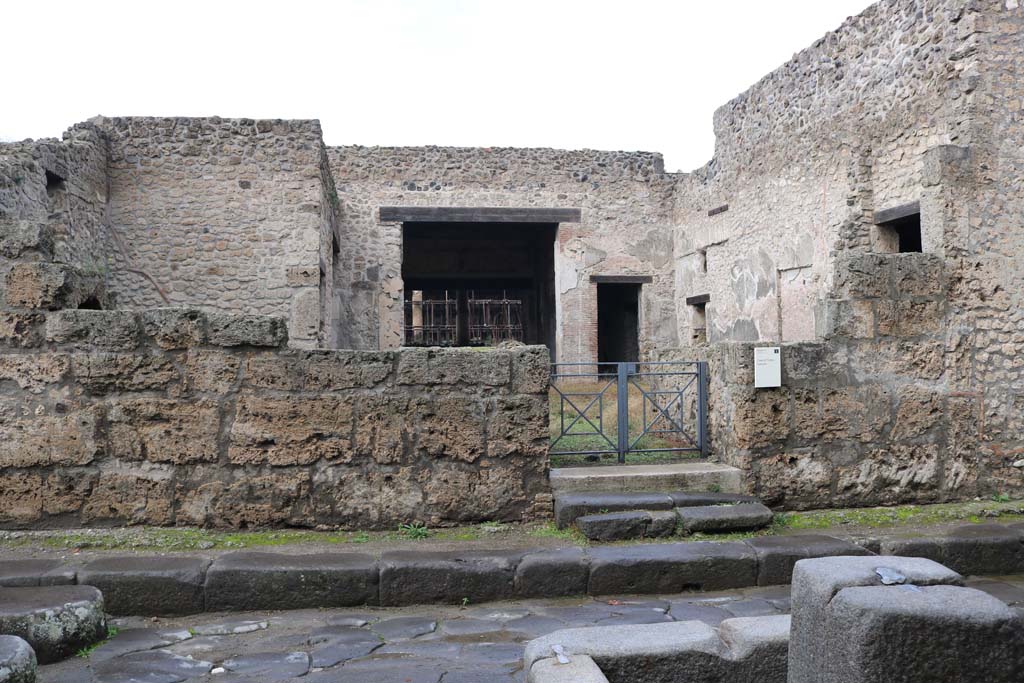 III.2.1, Pompeii. December 2018. 
Looking towards entrance doorway on north side of Via dellAbbondanza. Photo courtesy of Aude Durand.
