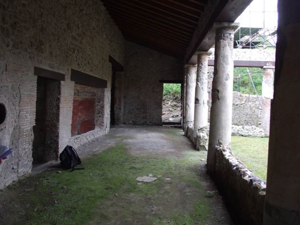 III.2.1 Pompeii.  March 2009.  South portico, looking west to door to side entrance (unexcavated side road).