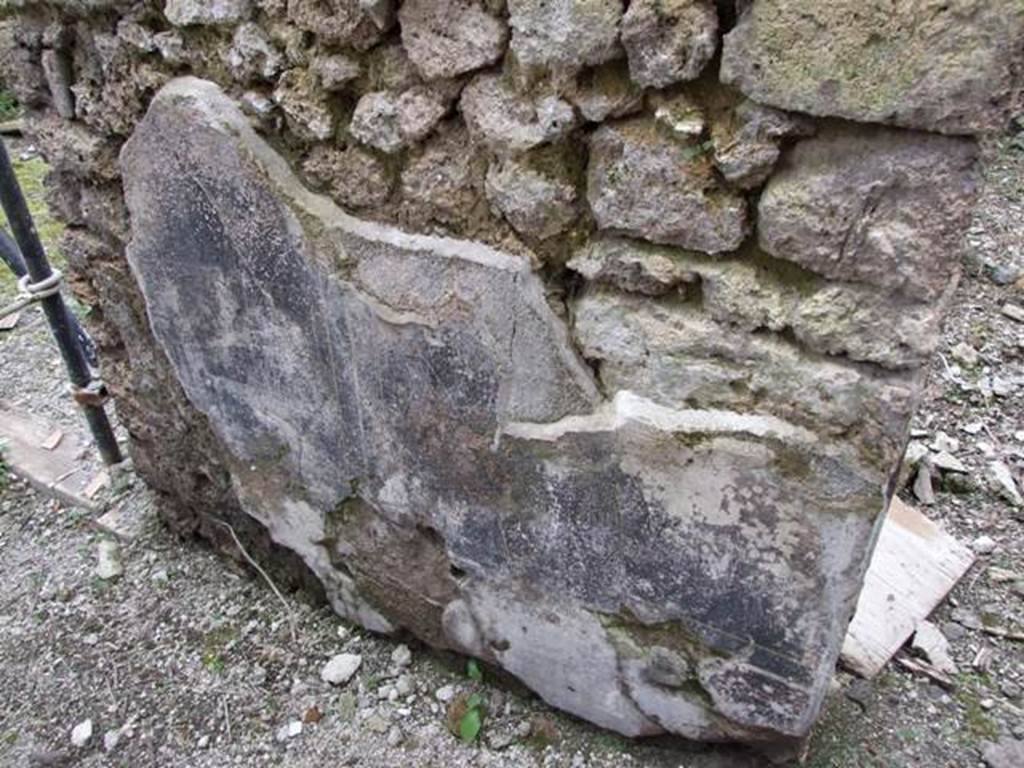 III.2.1 Pompeii.  March 2009.  Remains of plaster on west wall of small corridor, between rooms 17 and rooms 18.