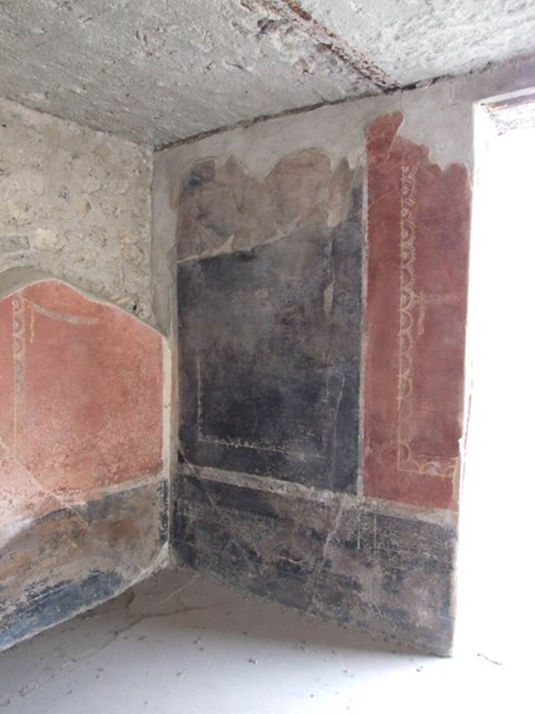 III.4.3  Pompeii.  March 2009. Room 3.  Triclinium.   Remains of painted panels on north wall, on west side of window.