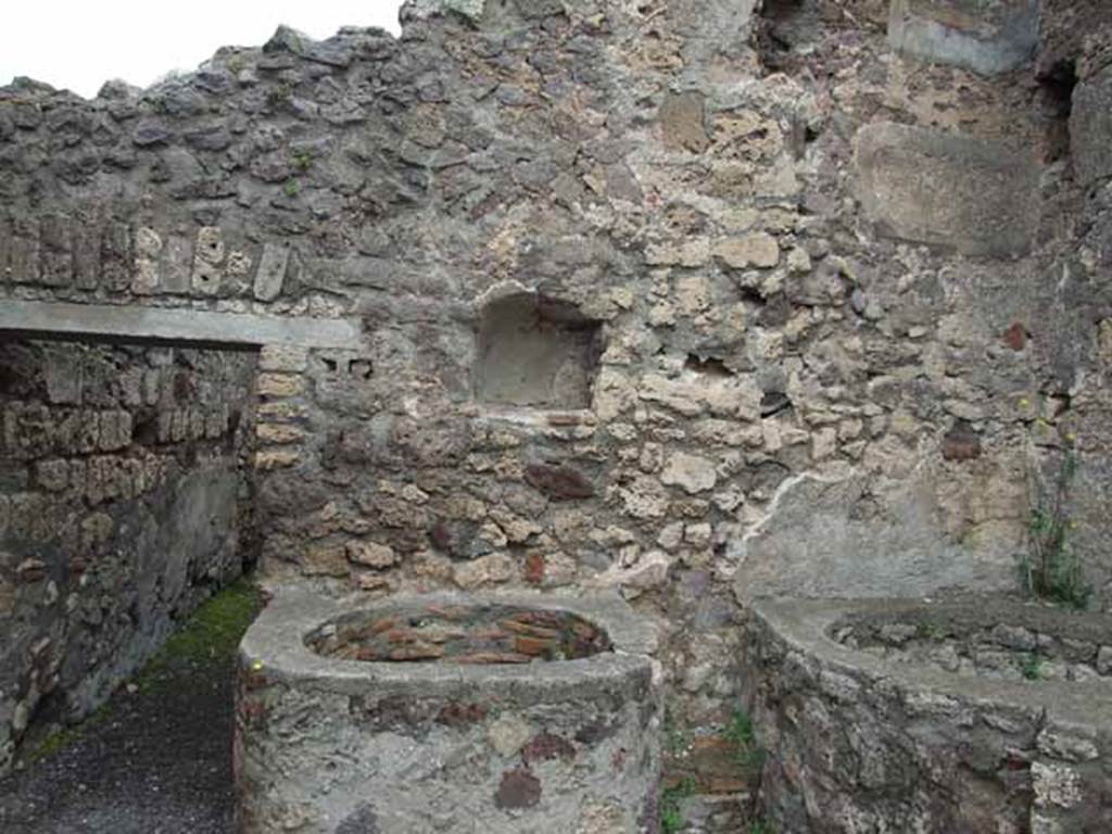 V.1.5 Pompeii. May 2010. North wall with door to rear room, niche and boilers.