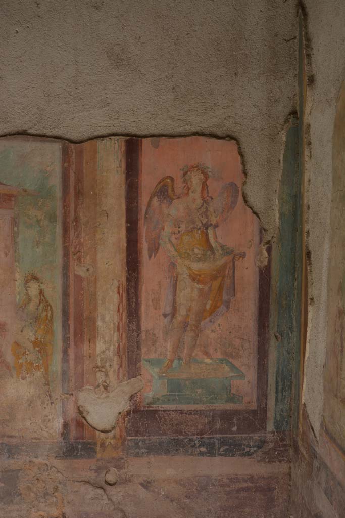 V.1.18 Pompeii. October 2019. 
Exedra “y”, west wall at north end. Wall painting of a winged figure possibly a muse.
Foto Annette Haug, ERC Grant 681269 DÉCOR.
