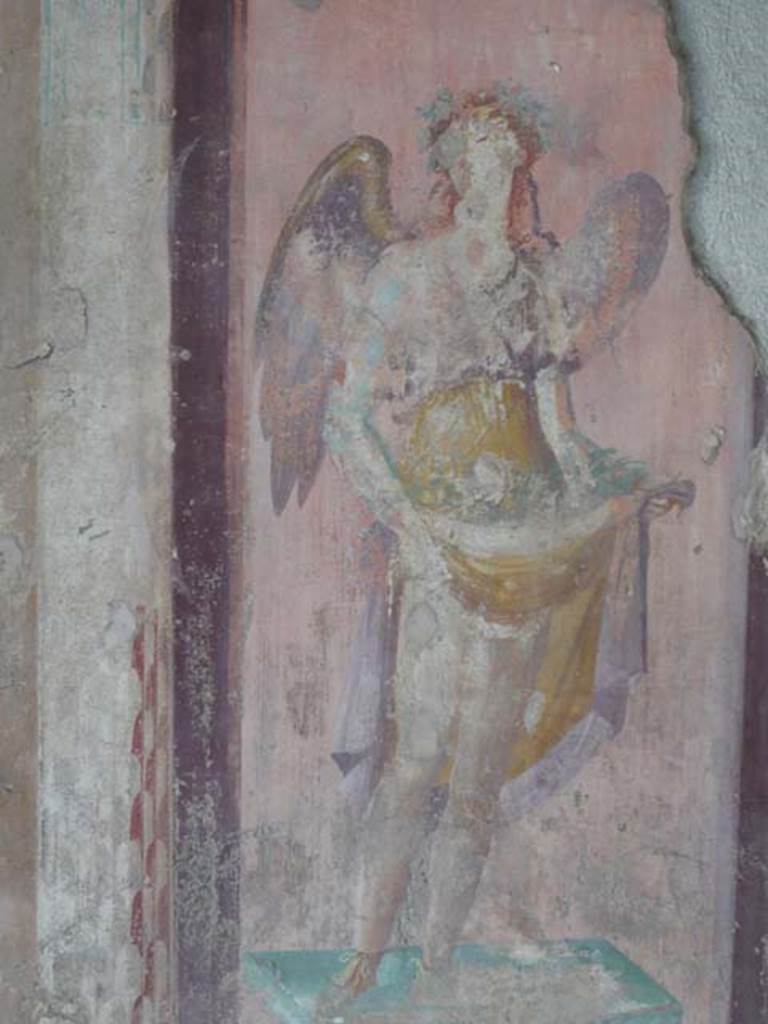 V.1.18 Pompeii. May 2012. West wall of exedra “y”, north end.   Detail of wall painting of a winged figure possibly a muse. Photo courtesy of Buzz Ferebee. 
